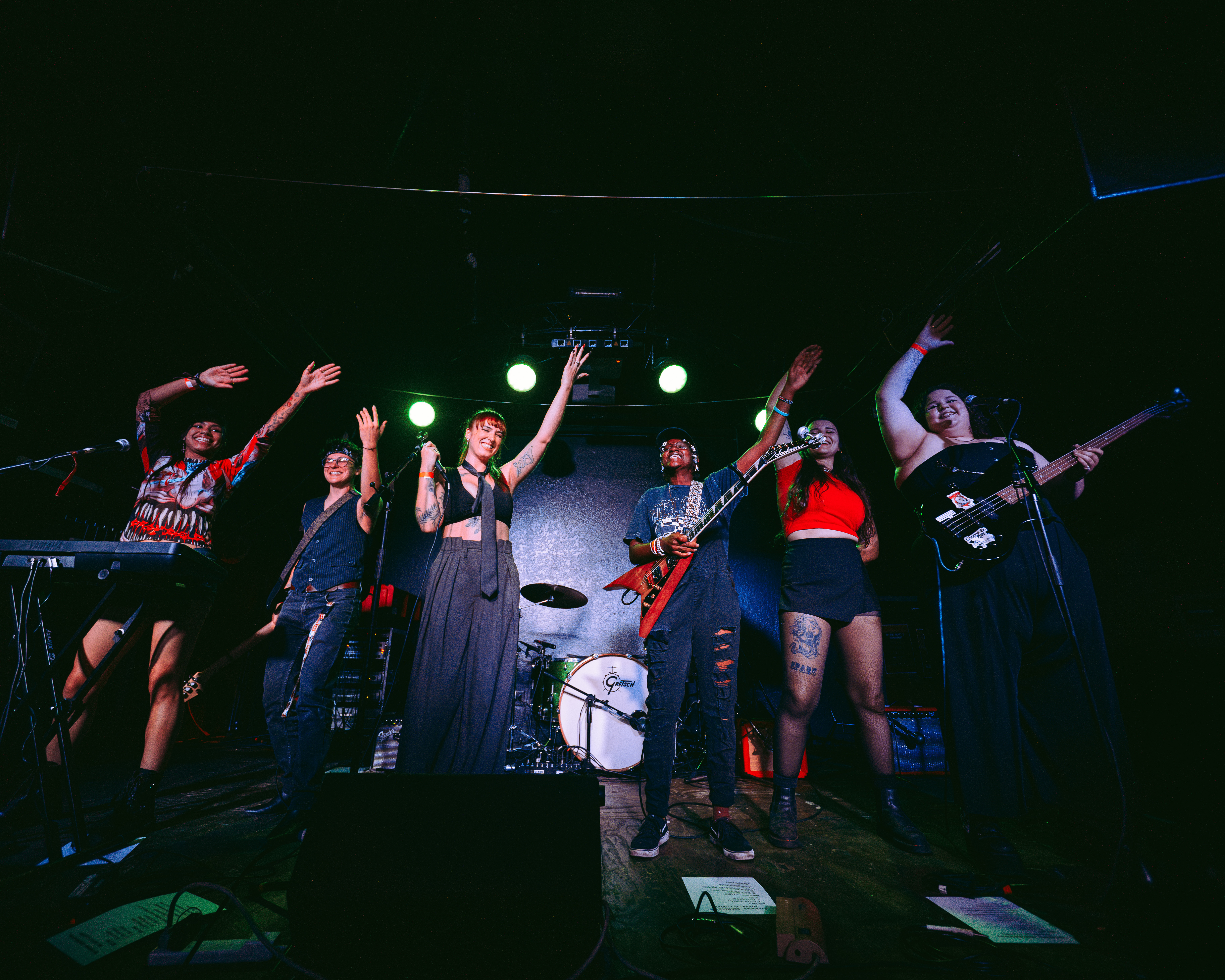 Bite Marks and friends standing together onstage