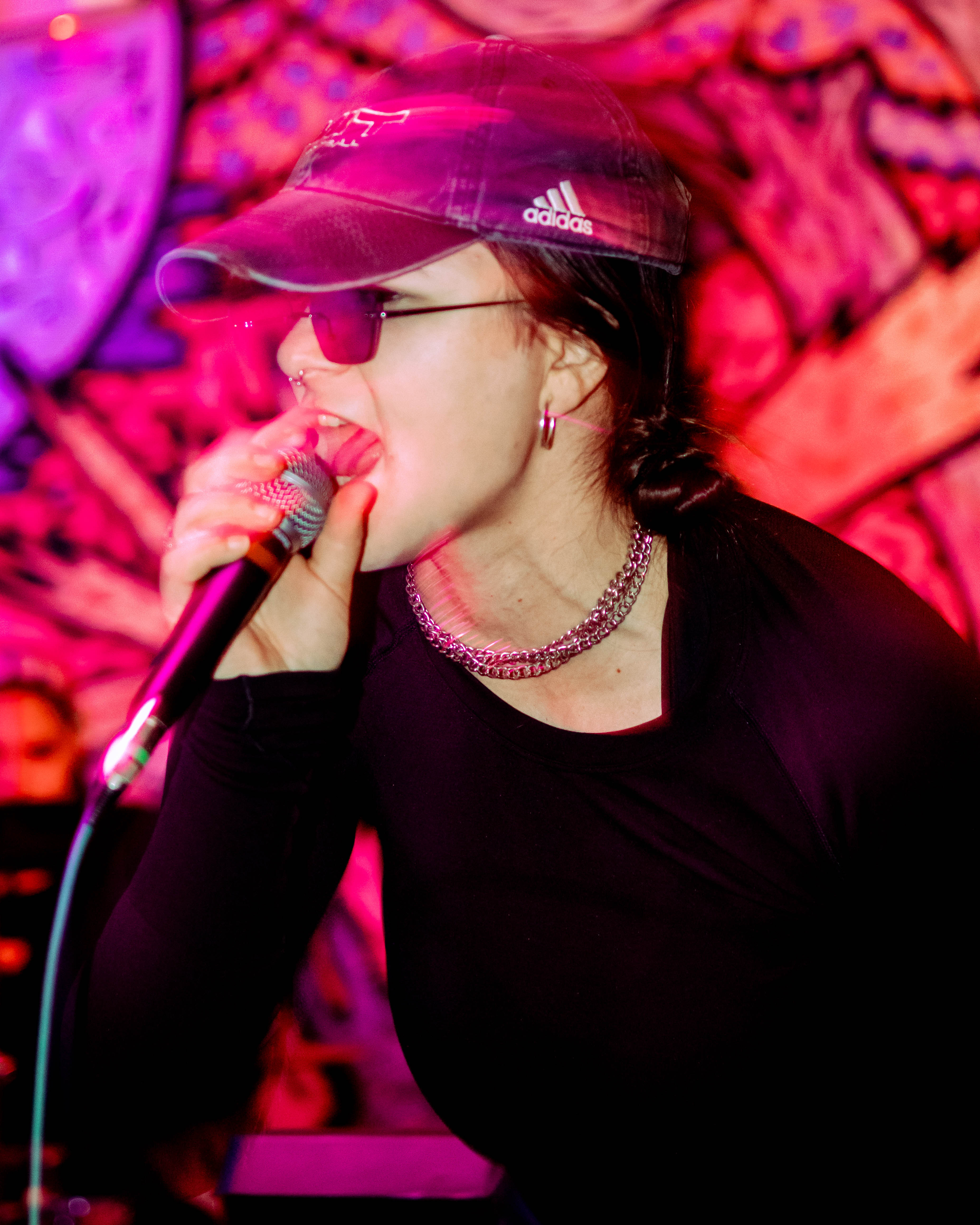 Bite Marks vocalist performing under pink stage lighting