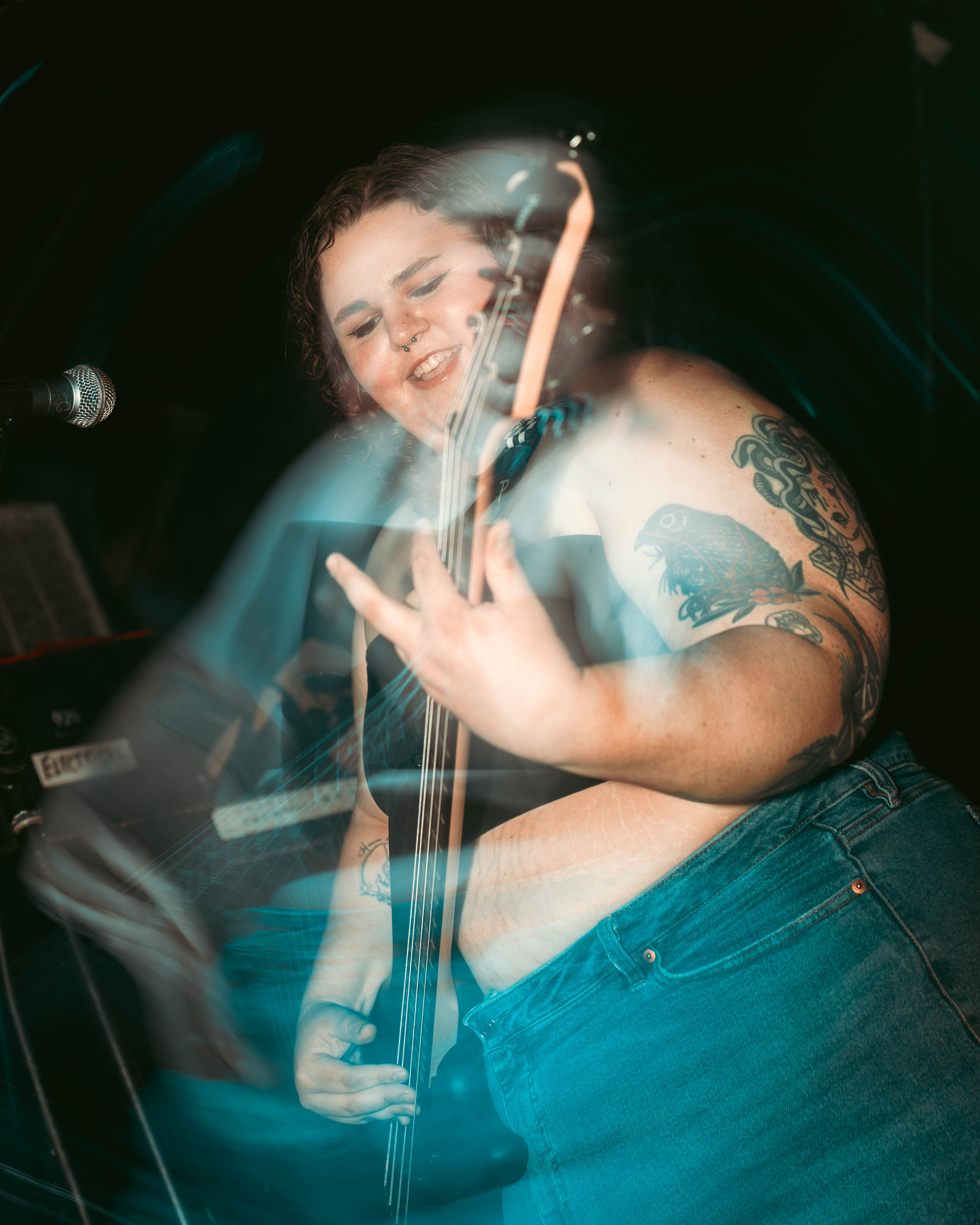 Bite Marks bassist performing with a light trail effect