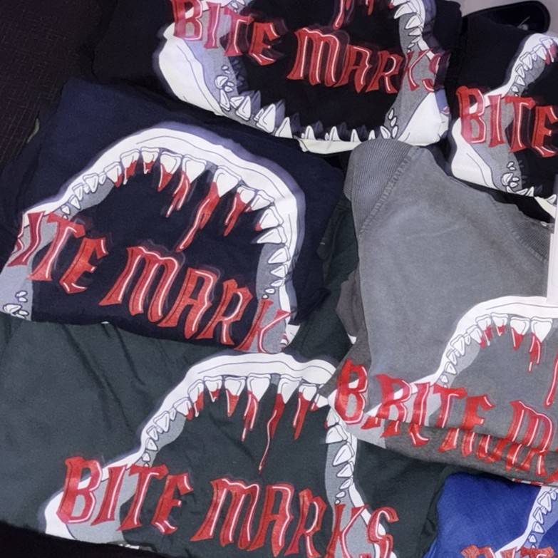 Folded Bite Marks shirts featuring the band logo